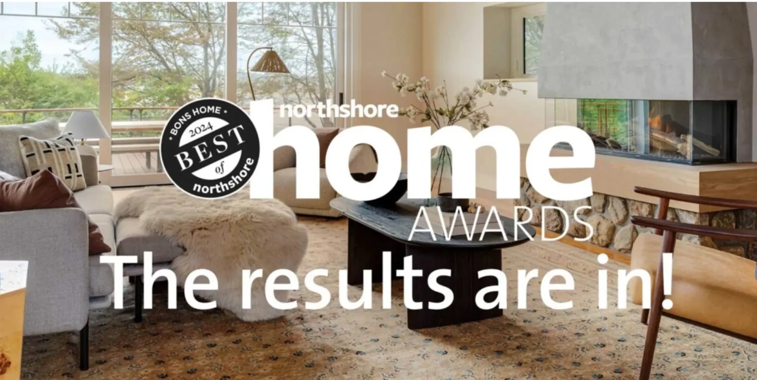 A bright, modern living room with large windows and stylish furniture. Text overlay reads: northshore home AWARDS. The results are in! featuring the “2024 Small Business Person of the Year Award for Massachusetts” badge.